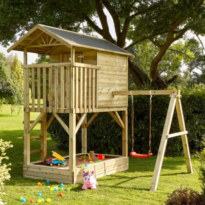 Beach Hut Playhouse with swing in garden setting